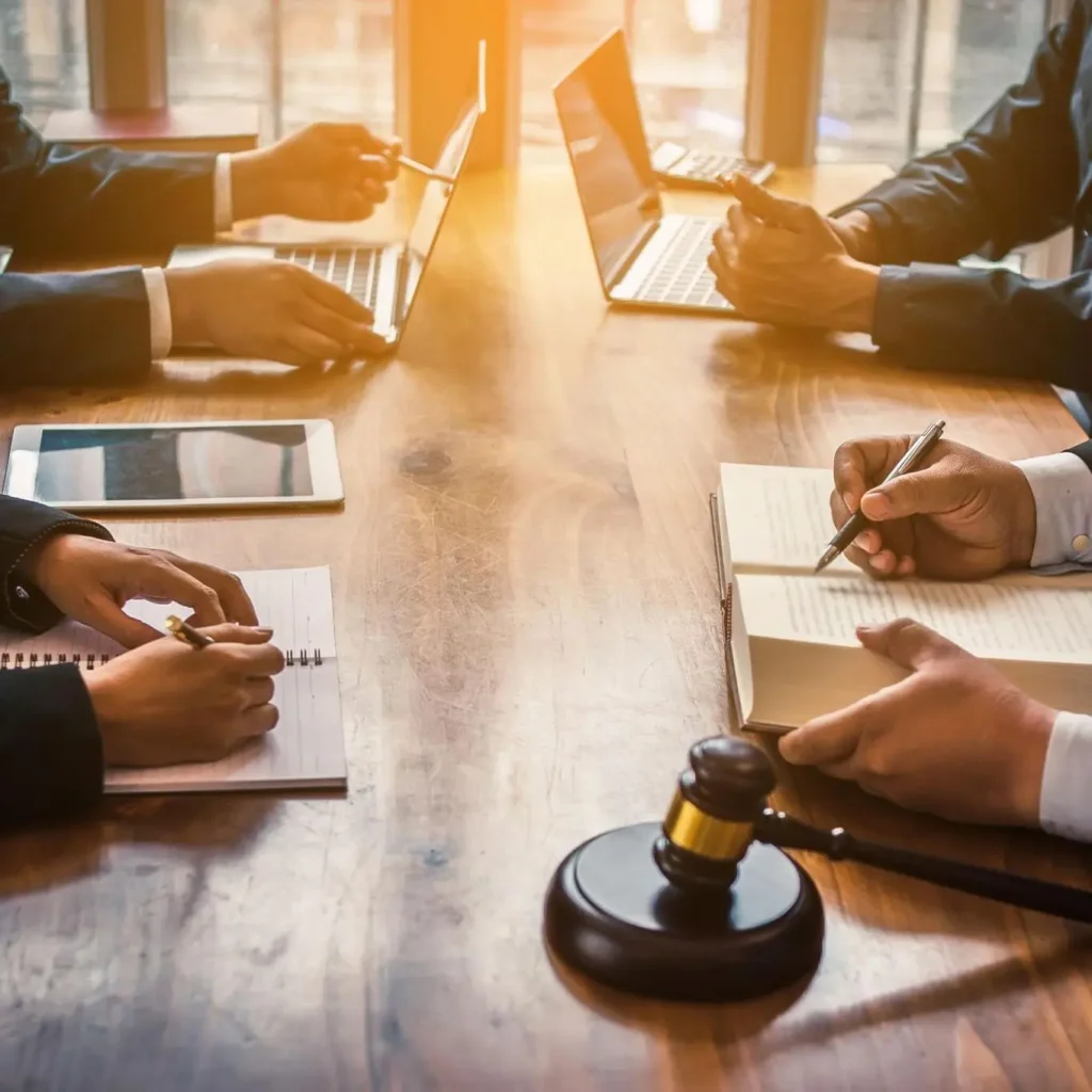 Lawyer providing pro bono legal consultation to a client in a professional office setting